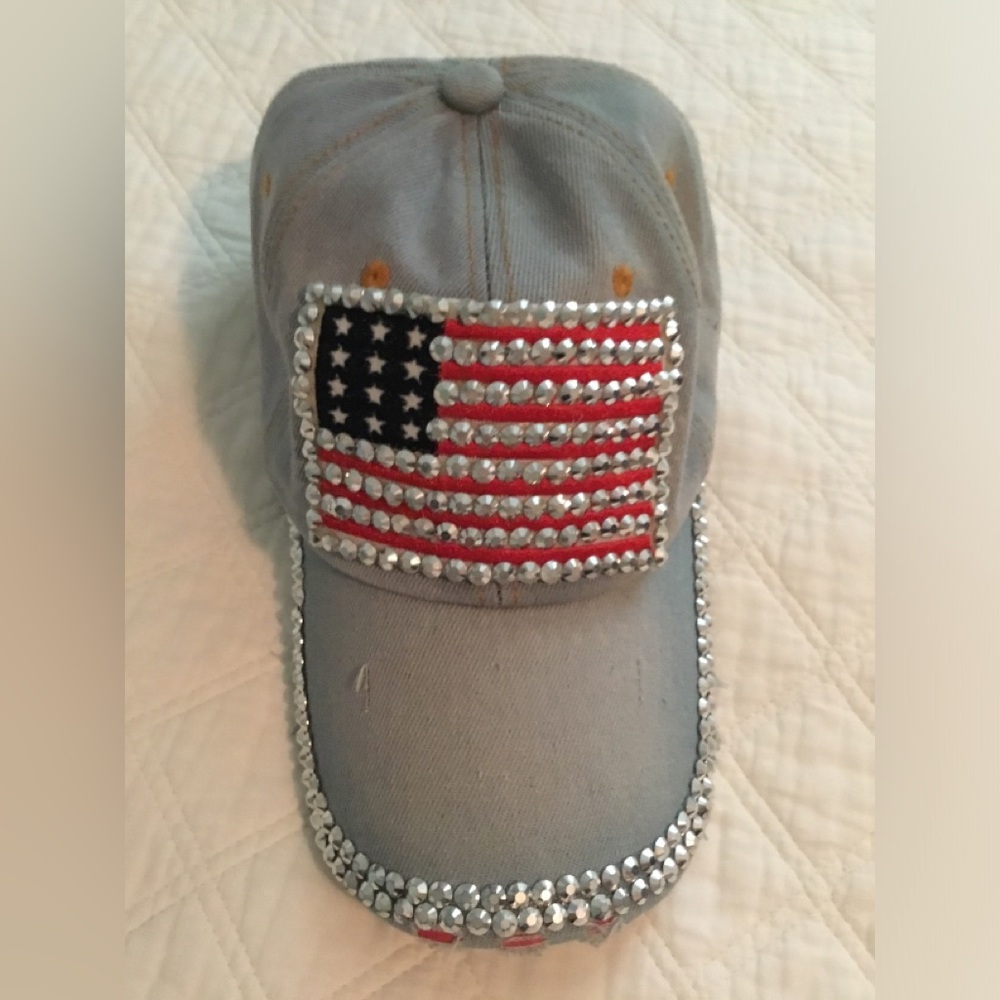 Bedazzled distressed American flag hat with adjustable strap.